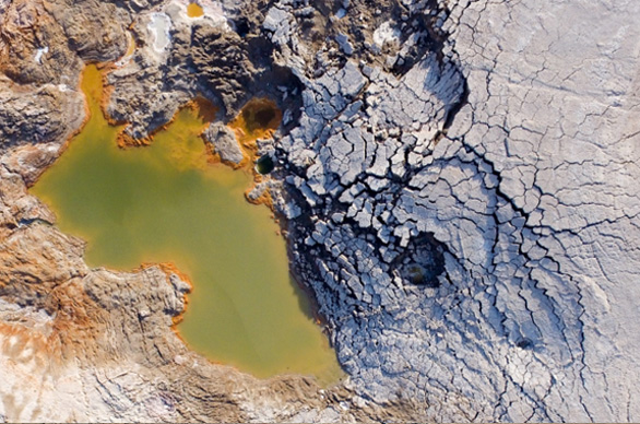 Aerial Photo Close-up of a nested, water-filled complex compound sinkhole at the Dead Sea